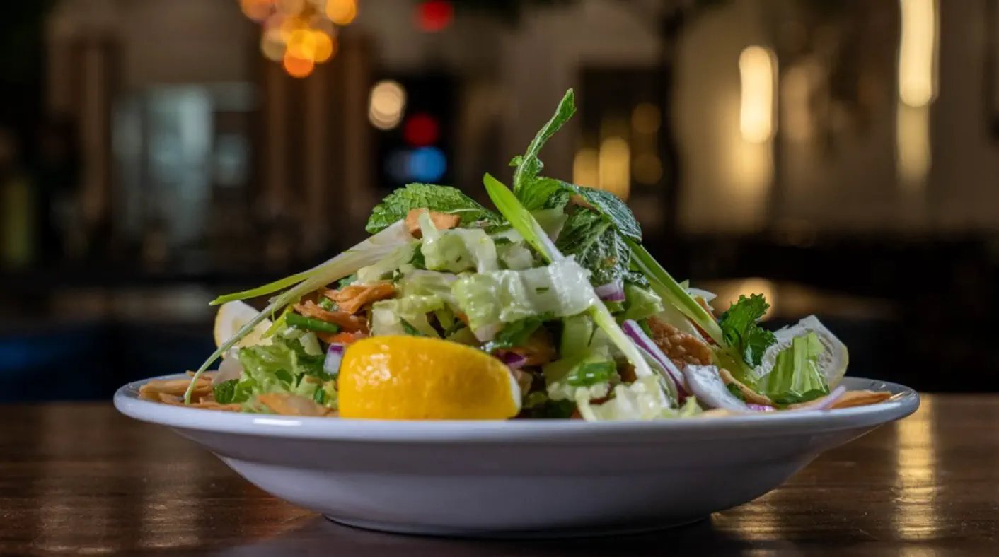 Fresh salad plated at Pasha